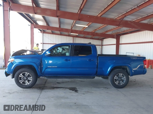 2017 Toyota Tacoma SR5 with VIN 3TMBZ5DN1HM009204, listed as a IAAI auction lot 41301765 with 129,923 mi miles and . Bid and sale history available at DreamBid. Image 14.