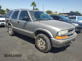 2002 Chevrolet Blazer LS с VIN 1GNDT13W02K126453, выставлен на аукционе Copart как лот 62340355 с пробегом 287 687 миль миль и Списание • Salvage title. История ставок и продаж доступна на DreamBid. Изображение 4.