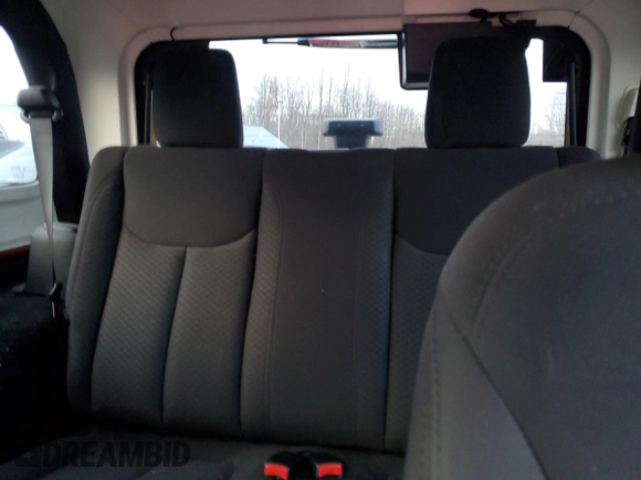 2015 Jeep Wrangler Willys Wheeler with VIN 1C4AJWAG9FL543998, listed as a Copart auction lot 88947025 with 142,433 mi miles and Salvage title. Bid and sale history available at DreamBid. Image 10.