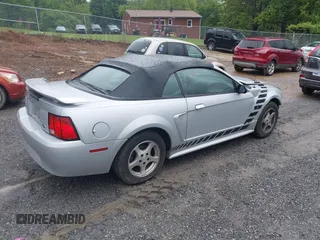 2002 Ford Mustang Deluxe z VIN 1FAFP44492F221578, wystawiony jako IAAI lot #42242232 z przebiegiem 107 773 mil mil oraz . Historia ofert i sprzedaży dostępna na DreamBid. Obrazek 4.