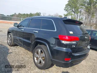 2014 Jeep Grand Cherokee Overland with VIN 1C4RJECG4EC197433, listed as a IAAI auction lot 41769932 with 198,568 mi miles. Bid and sale history available at carsss.com. Image 3.
