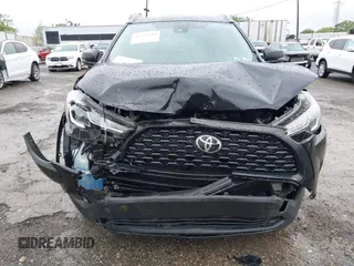 2022 Toyota Corolla Cross LE with VIN 7MUCAABG8NV004527, listed as a IAAI auction lot 42259519 with 15,211 mi miles and . Bid and sale history available at DreamBid. Image 11.