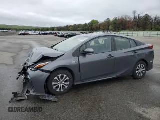 2021 Toyota Prius LE z VIN JTDKAMFP1M3172737, wystawiony jako Copart lot #57056205 z przebiegiem Nie podano mil oraz Szkoda całkowita • Salvage title. Historia ofert i sprzedaży dostępna na DreamBid. Obrazek 1.