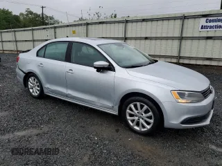 2011 Volkswagen Jetta SE with VIN 3VWDZ7AJ5BM319091, listed as a Copart auction lot 57991585 with 185,458 mi miles and Salvage title. Bid and sale history available at DreamBid. Image 4.