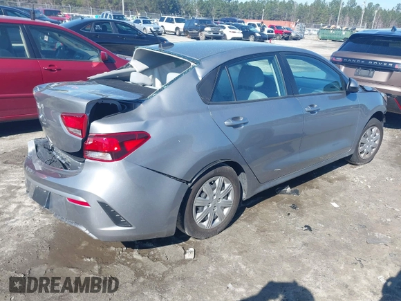2023 Kia Rio LX z VIN 3KPA24AD5PE603017, wystawiony jako IAAI lot #41590704 z przebiegiem 44 553 mil mil oraz . Historia ofert i sprzedaży dostępna na DreamBid. Obrazek 4.