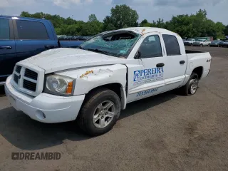 2006 Dodge Dakota SLT z VIN 1D7HW48N76S671886, wystawiony jako Copart lot #59487655 z przebiegiem Nie podano mil oraz Szkoda całkowita • Salvage title. Historia ofert i sprzedaży dostępna na DreamBid. Obrazek 1.