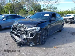 2018 BMW X6 sDrive35i with VIN 5UXKU0C5XJ0G80724, listed as a IAAI auction lot 41274338 with 122,696 mi miles. Bid and sale history available at carsss.com. Image 2.