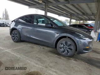 2025 Tesla Model Y Long Range with VIN 7SAYGDED2SF234388, listed as a Copart auction lot 47250965 with 3,702 mi miles and Salvage Title. Bid and sale history available at DreamBid. Image 4.