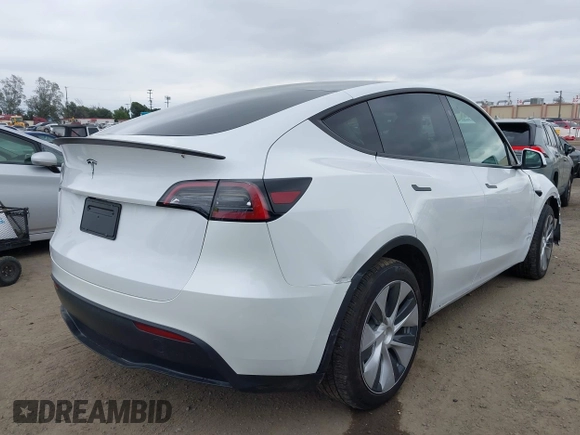 2024 Tesla Model Y with VIN 7SAYGDED4RF055859, listed as a IAAI auction lot 42201099 with 17,373 mi miles and . Bid and sale history available at DreamBid. Image 4.