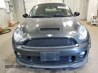 2012 MINI Coupe S z VIN WMWSX3C50CT154835, wystawiony jako Copart lot #76659984 z przebiegiem 122 425 mil mil oraz Szkody całkowita. Historia ofert i sprzedaży dostępna na DreamBid. Obrazek 5.