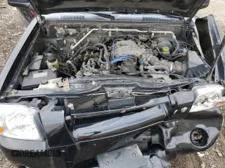2004 Nissan Frontier XE z VIN 1N6ED27T04C465904, wystawiony jako Copart lot #84096194 z przebiegiem 194 275 mil mil oraz Szkoda całkowita • Salvage title. Historia ofert i sprzedaży dostępna na DreamBid. Obrazek 11.