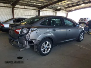 2012 Ford Focus SE with VIN 1FAHP3F28CL114572, listed as a Copart auction lot 63053035 with 142,994 mi miles and Salvage title. Bid and sale history available at DreamBid. Image 3.