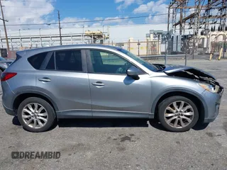 2014 Mazda CX-5 Grand Touring with VIN JM3KE2DY0E0331942, listed as a IAAI auction lot 41750533 with 163,387 mi miles. Bid and sale history available at carsss.com. Image 13.
