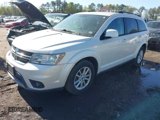 2013 Dodge Journey SXT with VIN 3C4PDCBG1DT563727, listed as a IAAI auction lot 42003852 with 202,516 mi miles and . Bid and sale history available at DreamBid. Image 2.