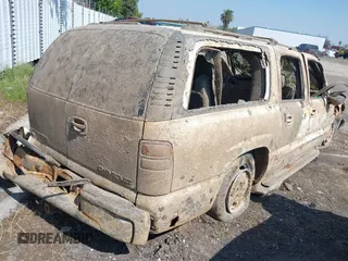 2003 Chevrolet Suburban LT z VIN 3GNEC16Z23G120835, wystawiony jako IAAI lot #41885363 z przebiegiem Nie podano mil oraz . Historia ofert i sprzedaży dostępna na DreamBid. Obrazek 4.
