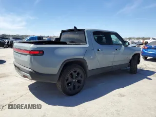 2022 Rivian R1T Adventure z VIN 7FCTGAAAXNN014983, wystawiony jako Copart lot #48987605 z przebiegiem Nie podano mil oraz Szkoda całkowita • Salvage title. Historia ofert i sprzedaży dostępna na DreamBid. Obrazek 3.