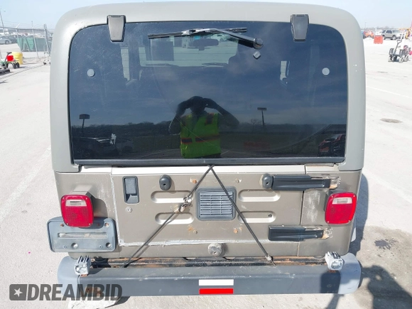 2006 Jeep Wrangler Sport Right Hand Drive with VIN 1J4F449S46P716520, listed as a IAAI auction lot 41763887 with 236,816 mi miles. Bid and sale history available at carsss.com. Image 6.