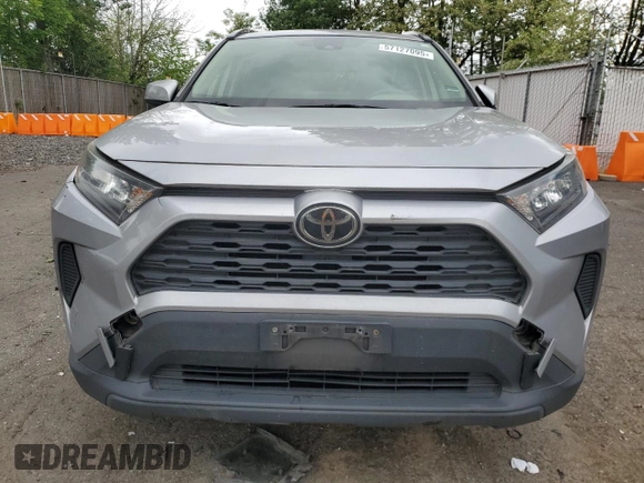 2019 Toyota RAV4 LE with VIN JTMG1RFV4KD004180, listed as a Copart auction lot 57127095 with 71,454 mi miles and Salvage title. Bid and sale history available at DreamBid. Image 5.