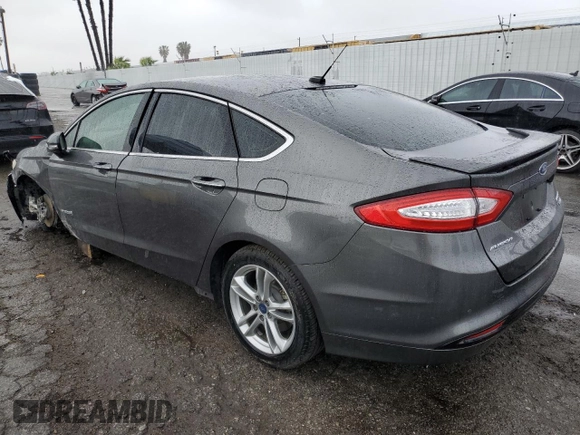 2016 Ford Fusion Titanium Hybrid z VIN 3FA6P0RU5GR356987, wystawiony jako Copart lot #48211775 z przebiegiem 145 192 mil mil oraz Szkoda całkowita • Salvage title. Historia ofert i sprzedaży dostępna na DreamBid. Obrazek 2.