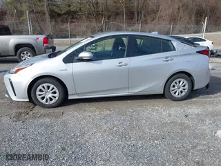 2021 Toyota Prius L Eco with VIN JTDKAMFU7M3143961, listed as a IAAI auction lot 41486032 with 58,979 mi miles. Bid and sale history available at carsss.com. Image 14.