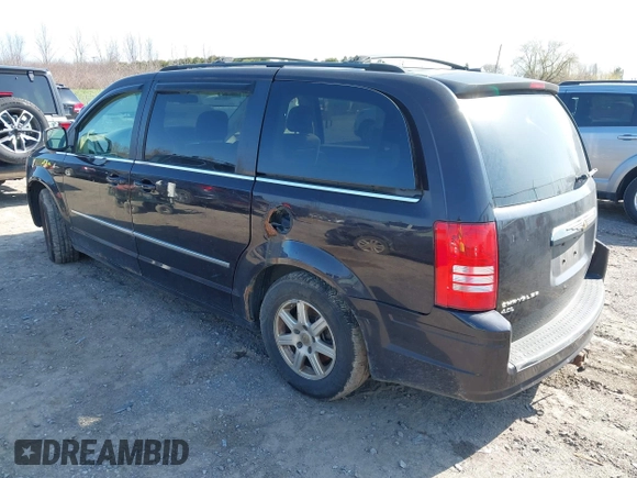 2010 Chrysler Town & Country Touring with VIN 2A4RR5DX5AR360173, listed as a IAAI auction lot 42082140 with 133,366 mi miles. Bid and sale history available at carsss.com. Image 3.