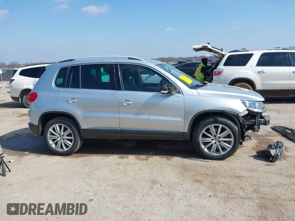 2013 Volkswagen Tiguan SE with VIN WVGAV7AX4DW545658, listed as a IAAI auction lot 41523168 with 188,729 mi miles and . Bid and sale history available at DreamBid. Image 14.