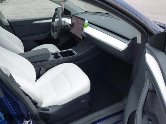 2023 Tesla Model Y Long Range with VIN 7SAYGDEE7PA194998, listed as a IAAI auction lot 41787170 with 16,221 mi miles and . Bid and sale history available at DreamBid. Image 5.