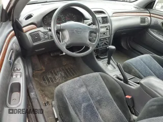 2000 Toyota Solara SE z VIN 2T1CG22P4YC340204, wystawiony jako Copart lot #56932265 z przebiegiem 168 041 mil mil oraz Czysty tytuł • Clean title. Historia ofert i sprzedaży dostępna na DreamBid. Obrazek 8.