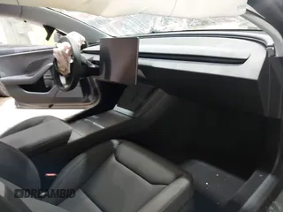 2025 Tesla Model 3 Long Range with VIN 5YJ3E1EA4SF913869, listed as a IAAI auction lot 41416608 with 1,141 mi miles and . Bid and sale history available at DreamBid. Image 5.