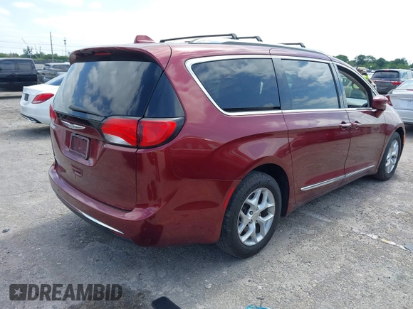 2017 Chrysler Pacifica Touring L with VIN 2C4RC1BG6HR739602, listed as a IAAI auction lot 42085250 with 96,377 mi miles and . Bid and sale history available at DreamBid. Image 4.