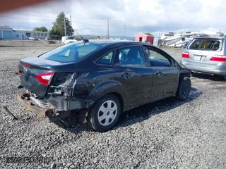2014 Ford Focus S with VIN 1FADP3E29EL176811, listed as a IAAI auction lot 41808719 with 84,600 mi miles. Bid and sale history available at carsss.com. Image 4.