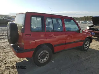 1998 Suzuki Sidekick JS z VIN 2S3TE02V3W6406072, wystawiony jako Copart lot #75855544 z przebiegiem 120 359 mil mil oraz Szkody całkowita. Historia ofert i sprzedaży dostępna na DreamBid. Obrazek 3.