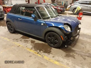 2015 MINI Convertible with VIN WMWZN3C58FT861657, listed as a IAAI auction lot 41562206 with 135,524 mi miles and . Bid and sale history available at DreamBid. Image 1.