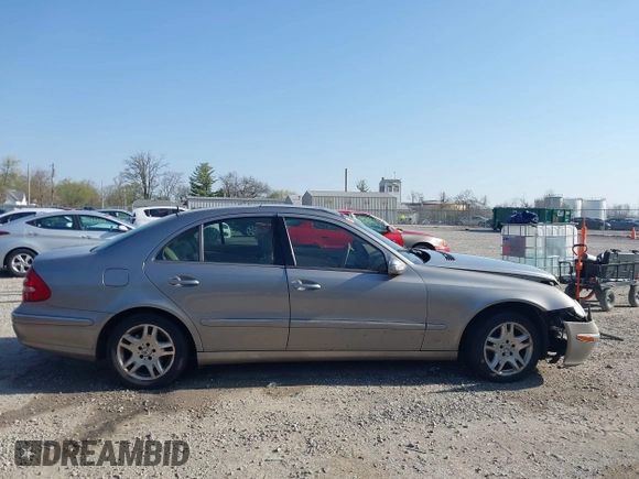 2003 Mercedes-Benz E-Class 3.2L with VIN WDBUF65J93X099223, listed as a IAAI auction lot 42033473 with 230,758 mi miles. Bid and sale history available at carsss.com. Image 13.