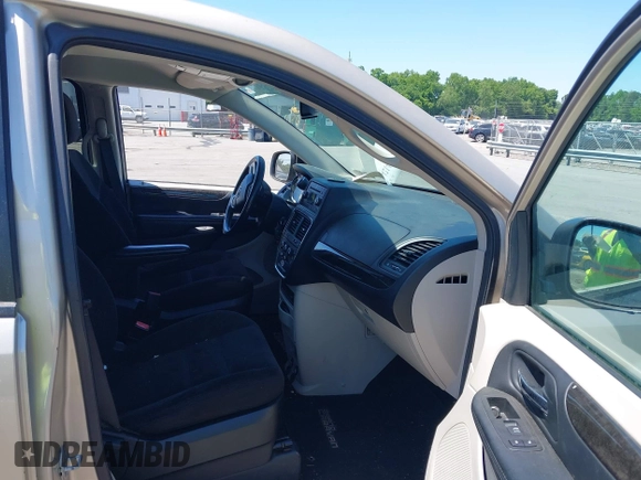 2015 Dodge Grand Caravan American Value with VIN 2C4RDGBG3FR647957, listed as a IAAI auction lot 42147813 with 129,859 mi miles and . Bid and sale history available at DreamBid. Image 5.