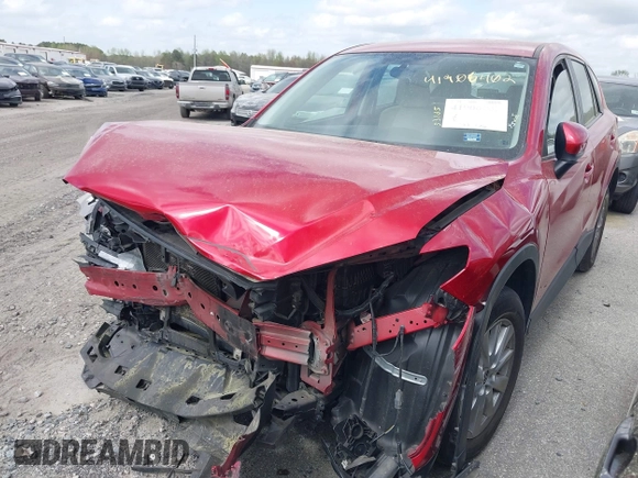 2016 Mazda CX-5 Sport with VIN JM3KE2BY9G0911535, listed as a IAAI auction lot 41906402 with 134,477 mi miles. Bid and sale history available at carsss.com. Image 2.