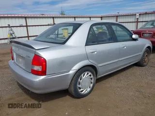 2002 Mazda Protege LX z VIN JM1BJ226X20523807, wystawiony jako IAAI lot #42373241 z przebiegiem 218 634 mil mil oraz . Historia ofert i sprzedaży dostępna na DreamBid. Obrazek 4.