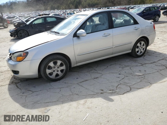 2009 Kia Spectra EX with VIN KNAFE221195655309, listed as a Copart auction lot 46620985 with 105,607 mi miles and Salvage Title. Bid and sale history available at DreamBid. Image 1.