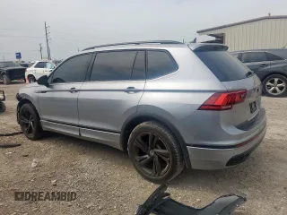 2023 Volkswagen Tiguan SE R-Line Black with VIN 3VVCB7AX5PM128335, listed as a Copart auction lot 56128305 with 21,524 mi miles and Salvage title. Bid and sale history available at DreamBid. Image 2.