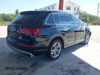 2017 Audi Q7 Premium Plus with VIN WA1LHAF75HD040203, listed as a IAAI auction lot 42064687 with 100,845 mi miles and . Bid and sale history available at DreamBid. Image 4.