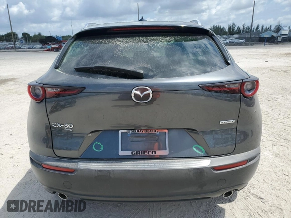 2024 Mazda CX-30 S Premium z VIN 3MVDMBDM4RM615609, wystawiony jako Copart lot #57761055 z przebiegiem 20 721 mil mil oraz Szkoda całkowita • Salvage title. Historia ofert i sprzedaży dostępna na DreamBid. Obrazek 6.