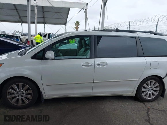 2011 Toyota Sienna XLE AAS with VIN 5TDYK3DC8BS148948, listed as a IAAI auction lot 41806293 with 144,645 mi miles and . Bid and sale history available at DreamBid. Image 15.