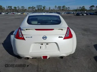 2013 Nissan 370Z z VIN JN1AZ4EH4DM380820, wystawiony jako IAAI lot #41547638 z przebiegiem 118 222 mil mil oraz . Historia ofert i sprzedaży dostępna na DreamBid. Obrazek 16.