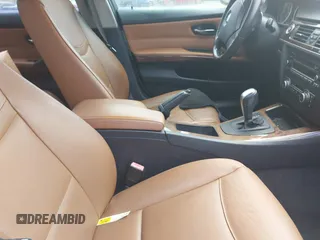 2011 BMW 3 Series 335i with VIN WBAPM5C51BE575704, listed as a IAAI auction lot 42005354 with 205,263 mi miles. Bid and sale history available at carsss.com. Image 5.