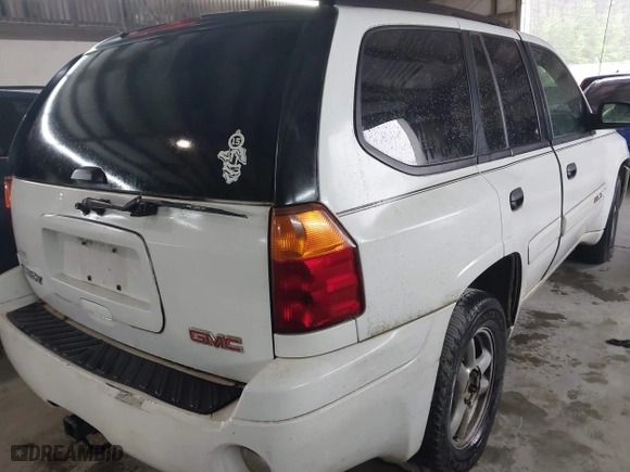 2004 GMC Envoy SLE with VIN 1GKDS13S642118163, listed as a IAAI auction lot 41809472 with 234,353 mi miles. Bid and sale history available at carsss.com. Image 4.