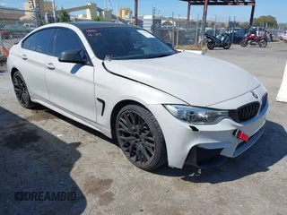 2015 BMW 4 Series 428i xDrive z VIN WBA4C9C54FD330582, wystawiony jako IAAI lot #42135691 z przebiegiem 127 289 mil mil oraz . Historia ofert i sprzedaży dostępna na DreamBid. Obrazek 1.