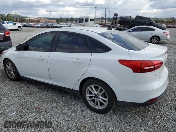2016 Ford Focus SE with VIN 1FADP3F21GL284681, listed as a Copart auction lot 51140975 with 141,704 mi miles and Salvage Title. Bid and sale history available at DreamBid. Image 2.