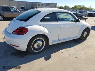 2012 Volkswagen Beetle 2.5L with VIN 3VWJX7AT0CM659261, listed as a Copart auction lot 79513824 with 144,537 mi miles and Salvage Title. Bid and sale history available at carsss.com. Image 3.