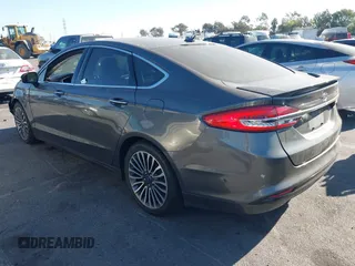 2017 Ford Fusion Titanium z VIN 3FA6P0SU5HR105477, wystawiony jako IAAI lot #41072696 z przebiegiem 92 926 mil mil oraz . Historia ofert i sprzedaży dostępna na DreamBid. Obrazek 3.