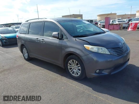 2014 Toyota Sienna XLE with VIN 5TDYK3DC2ES438980, listed as a IAAI auction lot 42067750 with 143,728 mi miles and . Bid and sale history available at DreamBid. Image 1.